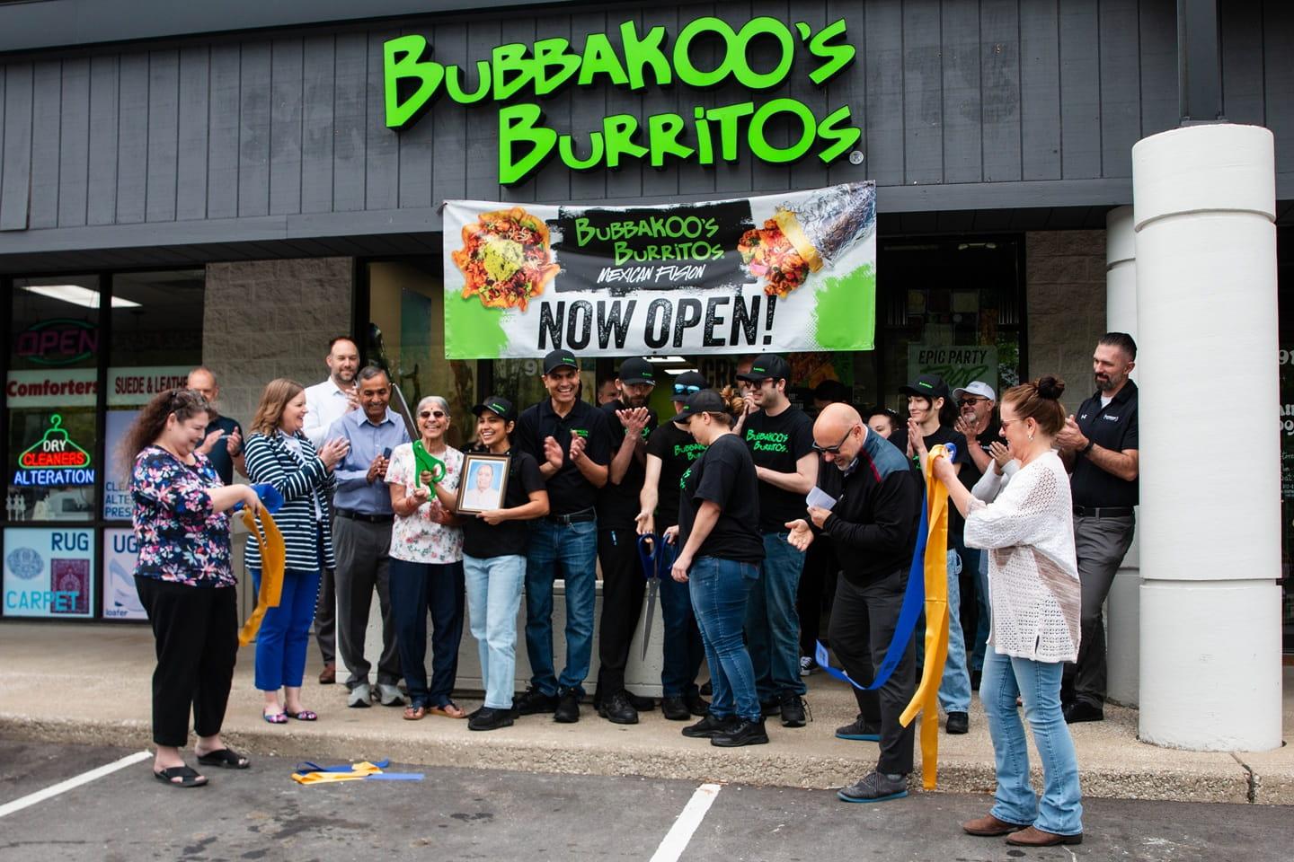 Bloomington, IL grand opening picture of front of Bubbakoo's Burritos with team